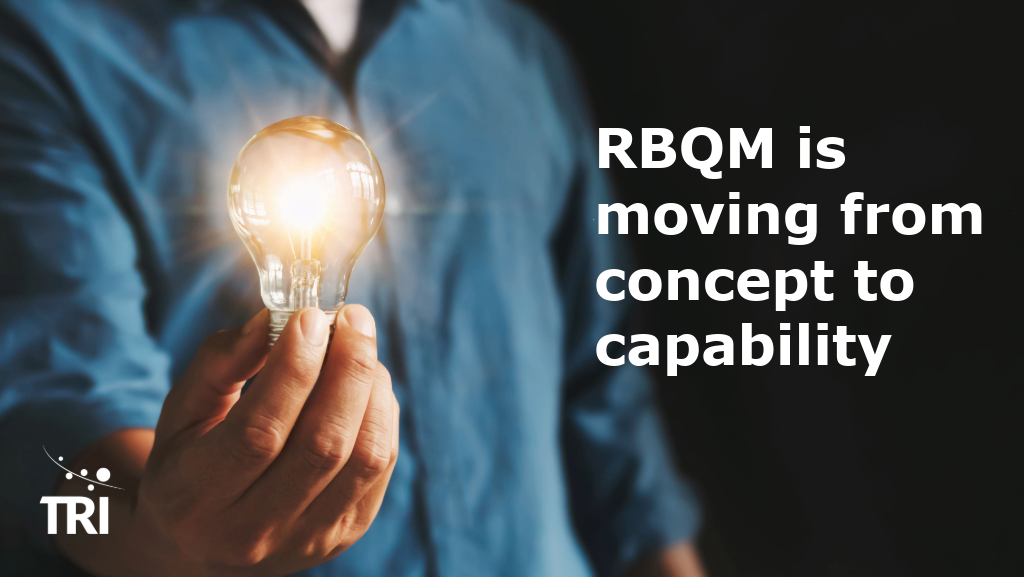 Person holding a lit light bulb beside the headline, “RBQM is moving from concept to capability,” with TRI branding.